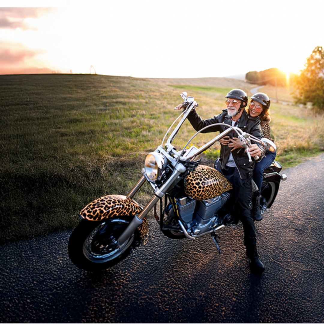 Two people riding motorcycle